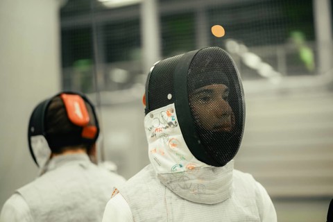 Close-up of fencer wearing protective mask focusing on his opponent, fencing, TSV Calw, Calw