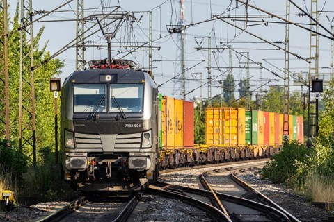 Freight train with freight containers on the Schusterbahn, a bypass of Stuttgart Central Station.