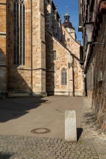 Alley to Widerholtplatz with traditional timber framed buildings and Martinskirche . historic