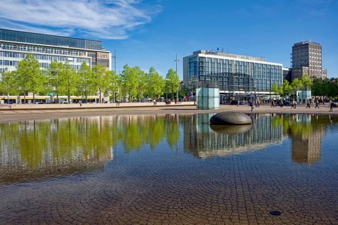 Radisson Blu Hotel, former main post office and Europe House on Leipziger Augustusplatz, water