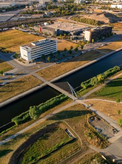 Modern bridge over a canal in evening light in an urban environment, airfield, Böblingen, Germany