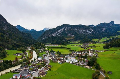 Drone image, Saalach, residential buildings, view of village with parish church, Unken, Pinzgau,