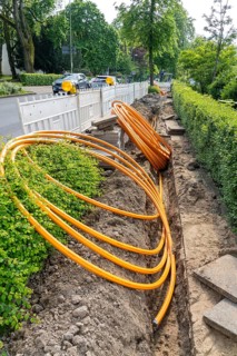 Laying of fibre optic cables, empty conduits are laid under a pavement, in which the actual fibre