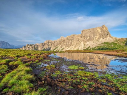 Mountains at sunset, reflection, Dolomites, Passo Giau, Belluno, Italy