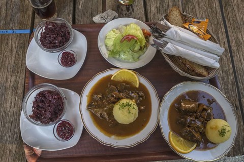 Franconian food is served on a tray in a beer garden, Bavaria, Germany