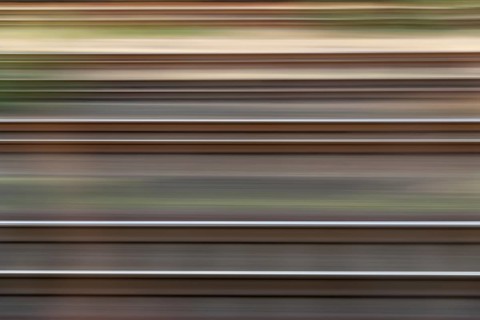 Dynamic view of railway tracks created by linear motion blur, Germany