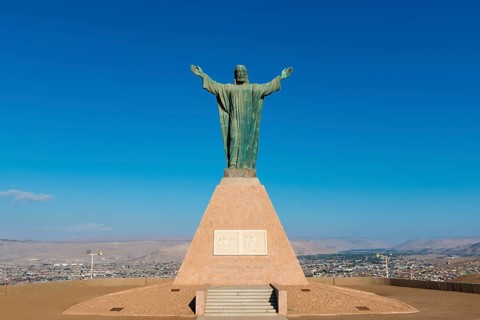 Large statue of Christ on the Morro de Arica lookout mountain, city of Arica, Chile