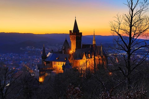 Atmospheric view of the illuminated Wernigerode Castle at sunset, Harz Mountains, Saxony-Anhalt,