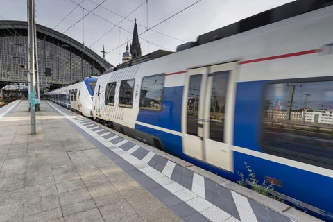 Local train leaving Cologne Central Station, Cologne, Rhineland, North Rhine-Westphalia, Germany
