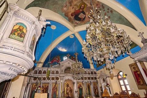 Magnificent church interior with chandelier, images of saints and painted vaulted ceiling, Platia