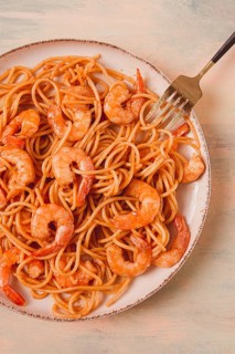 Spaghetti with king shrimps, with spices, top view, selective focus, homemade, no people