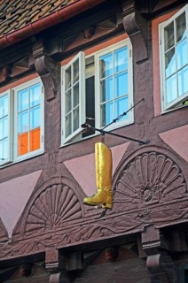 Boots as a shop sign in older quarters in Randers, Jutland, Denmark, Scandinavia