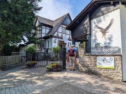 Entrance area of Adlerwarte Berlebeck, visitors at the ticket office, bird park, raptor