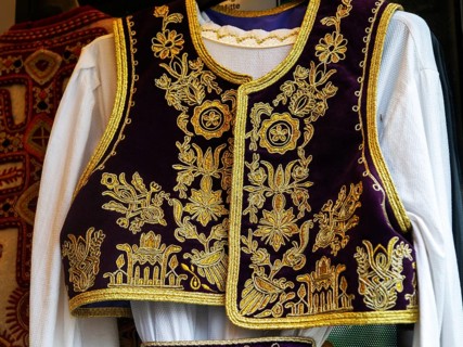 Detail of stitching of traditional textile clothing garment, Tirana, Albania