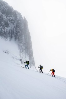 Dramatic atmosphere, Ski tourers, Snowy mountain landscape, Bernese Alps, Bernese Oberland,