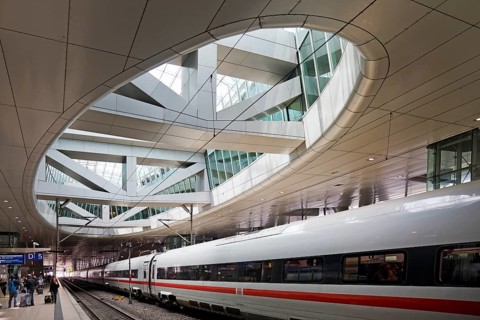ICE at the centre platform with the large opening to the glass dome, long-distance train station,