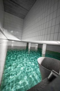 Modern water basin with white tiles and clear water surface, ENCW Netze Calw waterworks, Calw,
