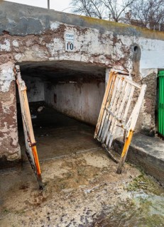 Old and dilapidated boat shelters that are not being used, old port area in Portocolom on the east