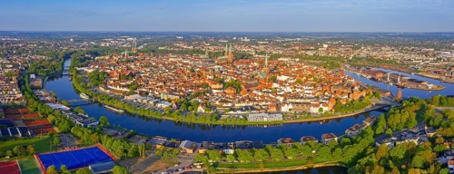 Aerial view over the river Trave and church towers in the old town of the Hanseatic City of Lübeck