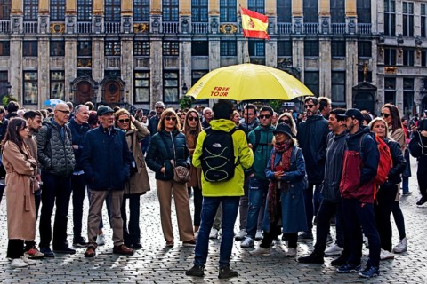 Group of people on a guided tour in one language on the Grand-Place, Grote Markt, Brussels, Belgium