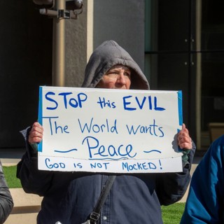 Detroit, Michigan USA - 7 April 2026 - People rally at the Federal Building to protest President