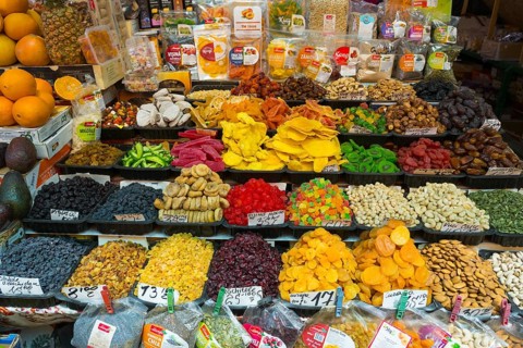 Diverse selection of colorful dried fruits and nuts on a market stand, Pia?a Centrala, Piata