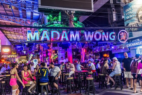 Crowds of people on Bangla Street in the evening. Nightlife on Bangla Walking Street with go-go