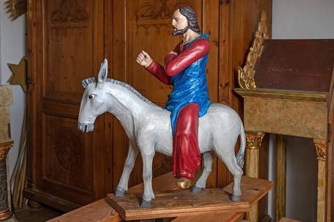 Palm tree, late Gothic figure of Christ, modern donkey, parish church of St. Lawrence, Otzing,