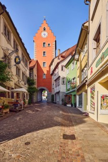 City gate to the Upper Town, historic residential buildings and commercial buildings, street made
