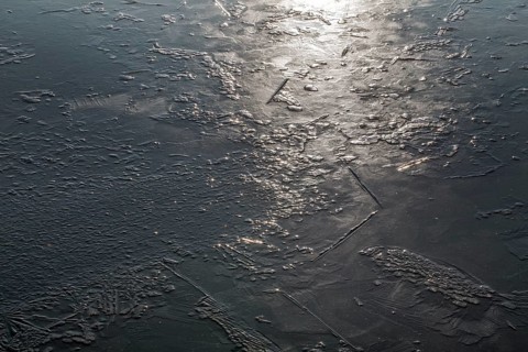 Frozen lake, structures of the water surface