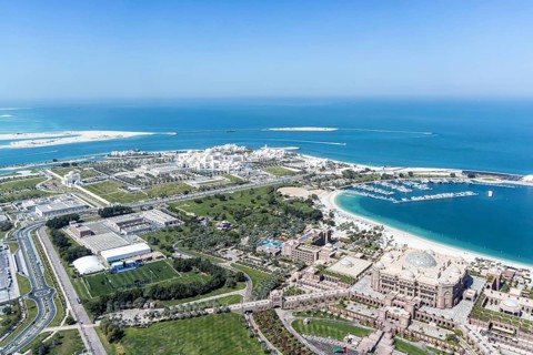 Abu Dhabi skyline from above with UAE Presidential Palace and Emirates Palace in Abu Dhabi, United