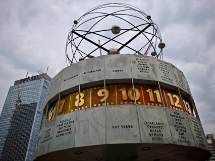 The world clock on Alexanderplatz shows different time zones under cloudy skies, Alexanderplatz,