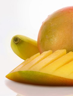 Mango and banana against white background, studio shot