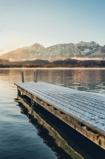 Frosty morning atmosphere during sunrise at Lake Hopfensee in the Allgäu in Bavaria, Germany
