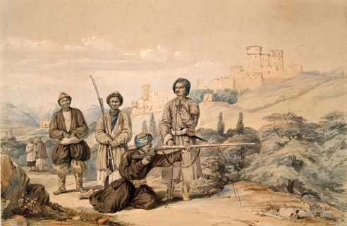A group of men in traditional robes with bows in front of a castle in a mountainous landscape