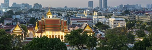 Panorama after sunset from Golden Mount to Wat Ratchanatdaram Worawihan and the skyline of Bangkok,