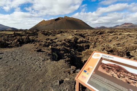 Hiking trail to the volcanic crater Caldera de Los Cuervos, information board, lava fields, Los