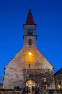 St Bartholomew's Church with poinsettia at dusk, Eschenau, Middle Franconia, Bavaria, Germany
