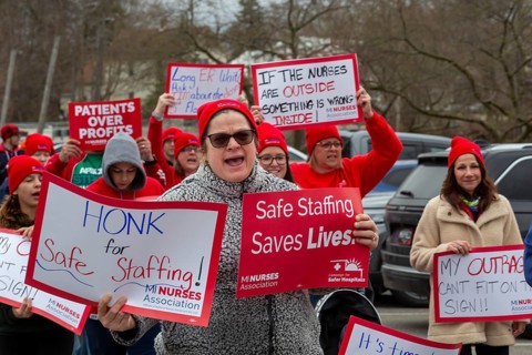 Lapeer, Michigan USA - 10 April 2026 - Members of the Michigan Nurses Association rally as their