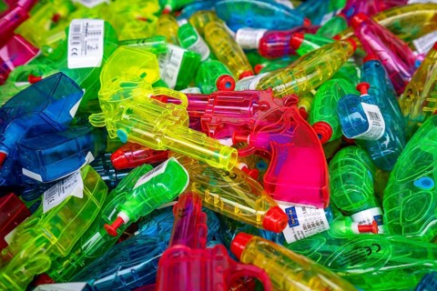 Colourful water guns in a shop display