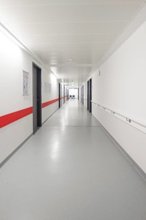 Long hospital corridor with white walls and a red line, Nagold Hospital of the Southwest Clinic