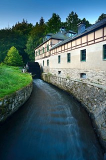 The Clodramühle, watermill with water wheel and half-timbered structure in the Elster Valley, Berga
