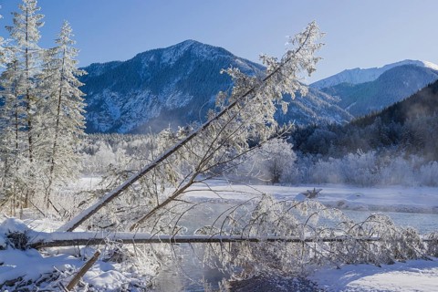 Isar valley in winter at temperatures of minus 18 degrees Celsius. Snow covered landscape with the