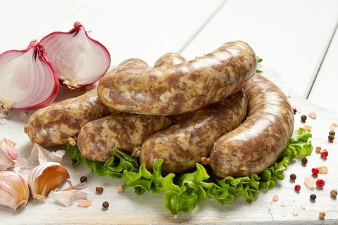 Raw kupaty, traditional Georgian sausages, raw sausages, with spices and herbs, Georgian cuisine