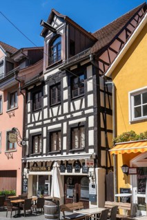 Historic half-timbered building with restaurant in the old town of Meersburg, Lake Constance