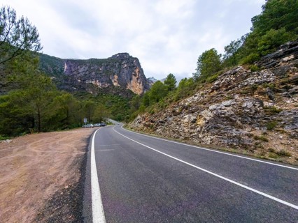 Entremon gorge road curves along the cinca river in huesca, spain, offering a scenic route through
