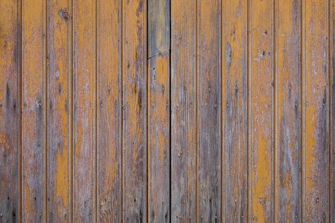 Old wooden door with peeling paint, texture, background, Apulia, Italy