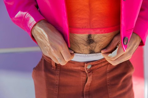 Cropped unrecognizable of a Spanish man stylishly dressed in pink in Quito, Ecuador. A vibrant