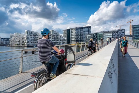Cyclists on the Bryggebroen cycle and footpath bridge over the harbour, Sydhavnen, Copenhagen is