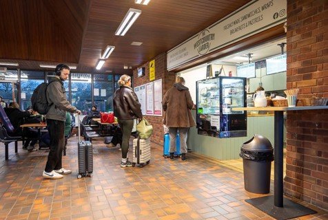 Passengers queuing at The Westcountry Larder Coffee takeaway shop shop, Tiverton Parkway railway